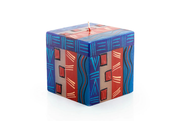 3" x 3" x 3" African Sky cube. Turquoise, dark blue, cream and dark tan in dots, sunbursts, and geometric designs.