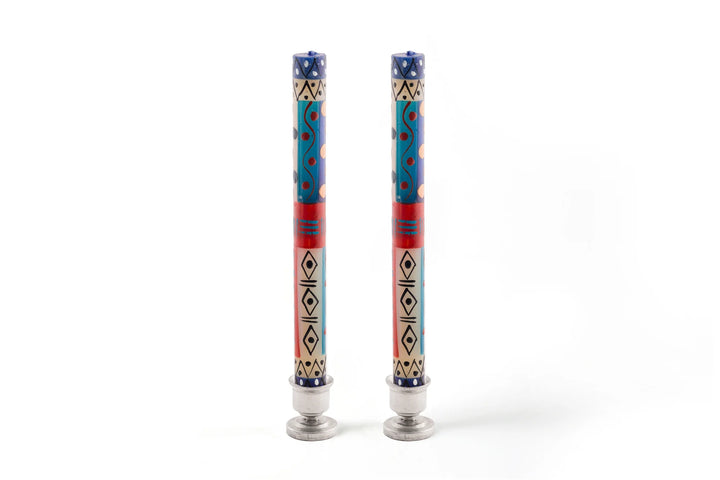 African Sky taper pair in small pewter candle holders. Turquoise, dark blue, cream and dark tan in dots, sunbursts, and geometric designs- very pretty!