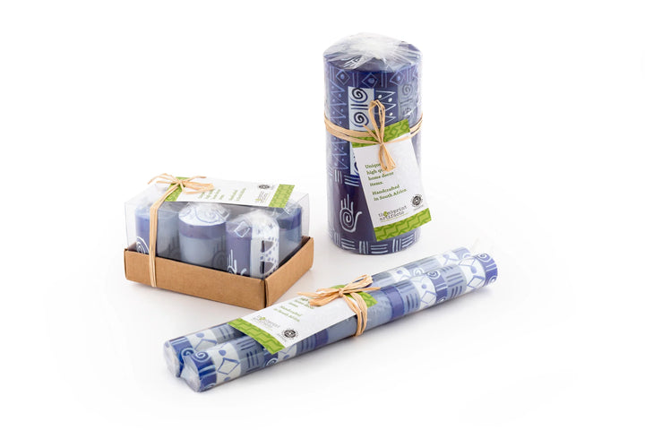 Packaging of the candles; votives are individually wrapped in a 6-pack gift box, pillars & cubes are wrapped and tied with story card, and the tapers are a matched pair, wrapped and tied with a story card.   All sustainable packaging.