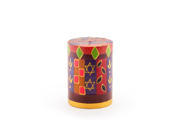 3" x 4" Judaica pillar candle. Rich colors of red, blue, light green, purple & turquoise with touches of gold and star of David intertwined in the design.