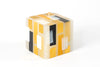 Klimt 3 X 3 X 3" cube candle. Creamy white base color candles with touches of black, gold and white.