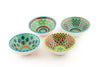 Tiny ceramic bowl, jasper green background with mixed patterns of dots & stripes in different sizes and colors.