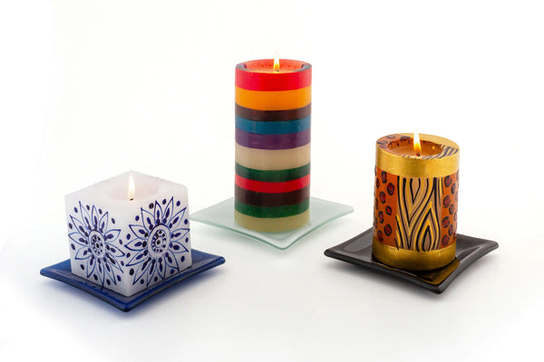 Candle coaster for pillar candles and cube candles. Photo shows blue coaster with a Henna Blue on  white cube candle, white coaster with a Memphis Stripe pillar and black coaster with an Animal Print  pillar.