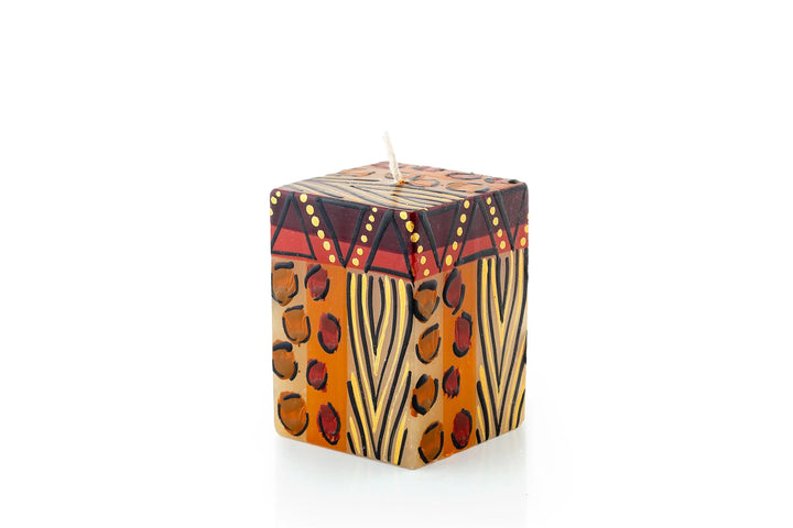 Animal Print 2" x 2" x 3" cube candle. Hand crafted. Each candle is painted with 'prints' of African animals and touches of gold.  Fair Trade products. 