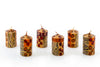 Animal Print 2" votive candles that come in a 6-pack gift box. Hand crafted. Each candle is painted with 'prints' of African animals and touches of gold.  Fair Trade products. 