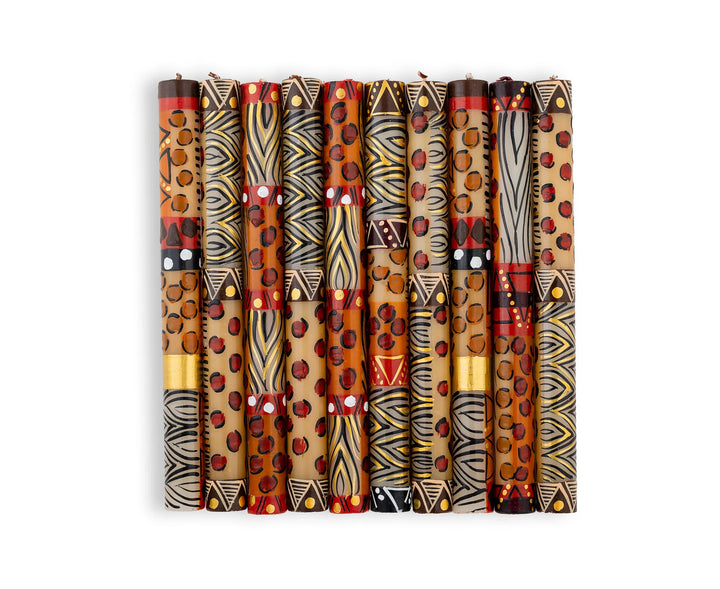 Animal Print hand made and hand painted candle collection.  Each candle is painted with 'prints' of African animals and touches of gold.  These 10  Dinner tapers illustrate the 10 different designs in the collection.  Tapers are purchased as a matched pair. Fair Trade products. 