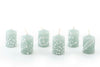 Henna Duck Egg 2" votives that come in a 6-pack gift box.   Each votive has a henna design painted in white on beautiful duck egg green candle.   