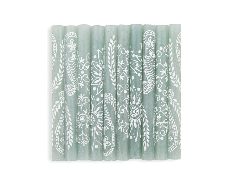 Henna Duck Egg Collection. 
 10 9" tapers show the designs of this collection.  Each has a henna designs painted in white on beautiful duck egg green candles.    Stunning Fair Trade home decor.