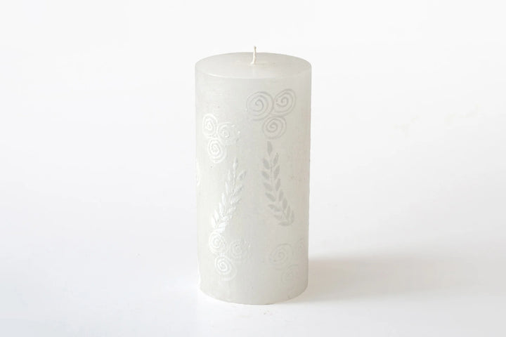 3" x 6" White on white pillar candle. The designs include floral or graphic patterns painted in white on a white candle. Exquisite as they burn as the candle lights from within and shows the artistry on the candle.