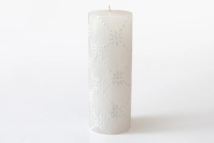 3" x 8" White on white pillar candle. The designs include floral or graphic patterns painted in white on a white candle. Exquisite as they burn as the candle lights from within and shows the artistry on the candle.