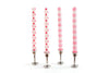 4 taper candles in pewter taper candle holders.  Two white taper candles with pink dots, and two white taper candles with pink stripes.