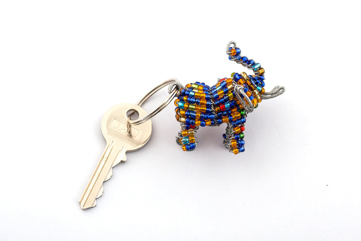 Beaded elephant key chain, handmade with blue & golden beads.  Trunk up for good luck!