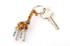 Beaded giraffe keychain, handmade in golden & blue beads. So cute! Fair Trade products.